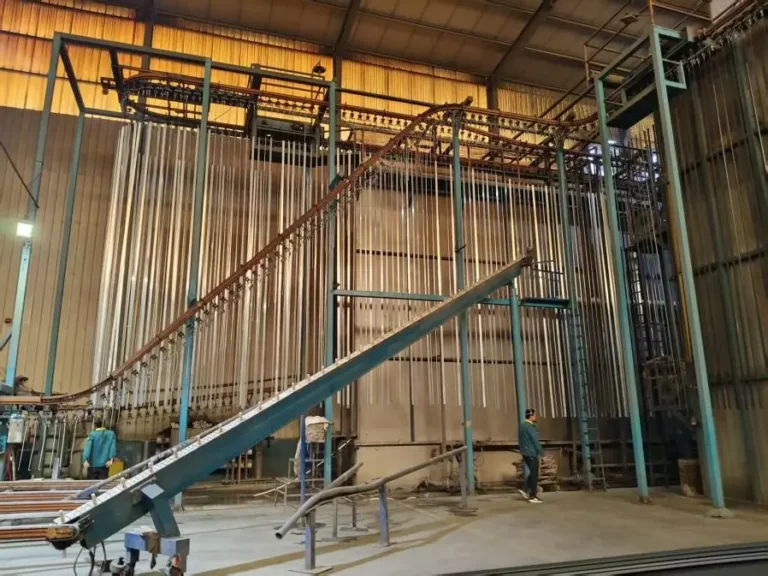Precision manufacturing and stable quality control in aluminum extrusion facility by Yoverd Aluminium, showing large-scale hanging production line with hundreds of profiles for ultra-high dimensional accuracy, perfect straightness and consistent mechanical performance