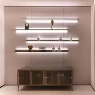 Real-world application of custom decorative aluminum profiles: modern interior with LED backlit floating shelves and contemporary console cabinet, showcasing elegant, durable and functional solutions for architecture and interior design