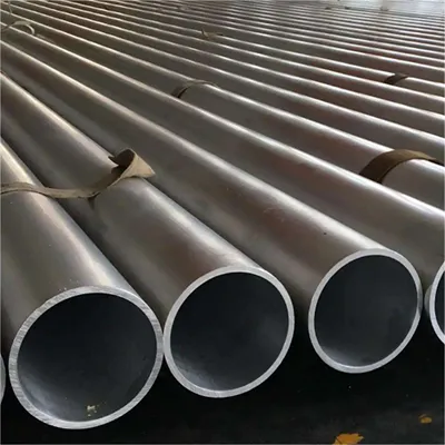 Multiple large diameter custom aluminum round tube extrusions neatly bundled with straps in industrial setting, ready for global construction and engineering projects by Yoverd Aluminium.