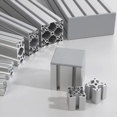 Assortment of heavy-duty silver aluminum extrusion profiles in various cross-sections and lengths, showcasing reinforced T-slot designs for high-strength modular machine frame systems by Yoverd Aluminium.