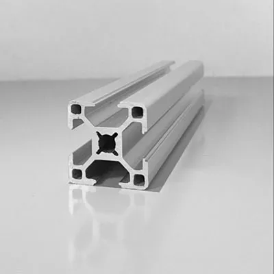 Detailed view of high-precision silver aluminum extrusion profiles showcasing complex internal cross-section structure ideal for high-accuracy equipment frame systems by Yoverd Aluminium