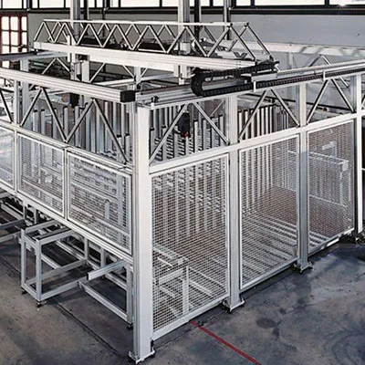 Spacious industrial facility featuring robust aluminum extrusion profiles built into multi-level safety fence and partition systems with wire mesh panels and structural overhead frames for secure area separation and protection by Yoverd Aluminium.