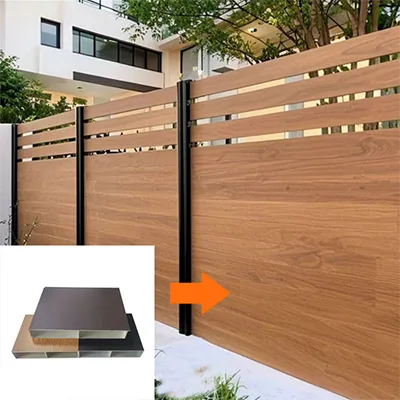 Stylish horizontal wood-grain aluminum privacy screen railing fence installed in a contemporary residential backyard with a modern white house and trees, showing aluminum profile cross-sections with an arrow indicating the material by Yoverd Aluminium.