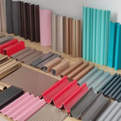 A wide variety of colorful custom decorative aluminum extrusion profiles in different shapes and finishes displayed on shelves for architectural and industrial use by Yoverd Aluminium.