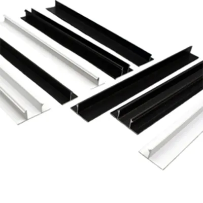 Multiple black and silver custom decorative aluminum extrusion profiles in L-shaped and channel designs arranged on white background for architectural and industrial applications by Yoverd Aluminium.