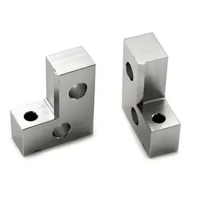 High precision CNC machined solid aluminum corner brackets with drilled mounting holes, ideal for heavy-duty structural connections and industrial frameworks by Yoverd Aluminium.