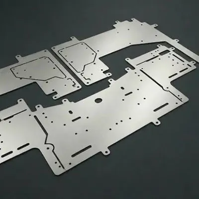 Set of high precision CNC machined aluminum panels and plates with intricate cutouts, mounting holes and custom shapes designed for industrial machinery and engineering applications by Yoverd Aluminium.